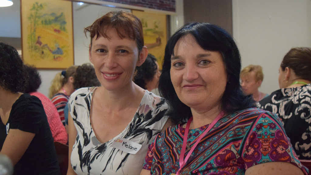 Melanie Gibbons and Tina Lambert catch up at the WoW breakfast.